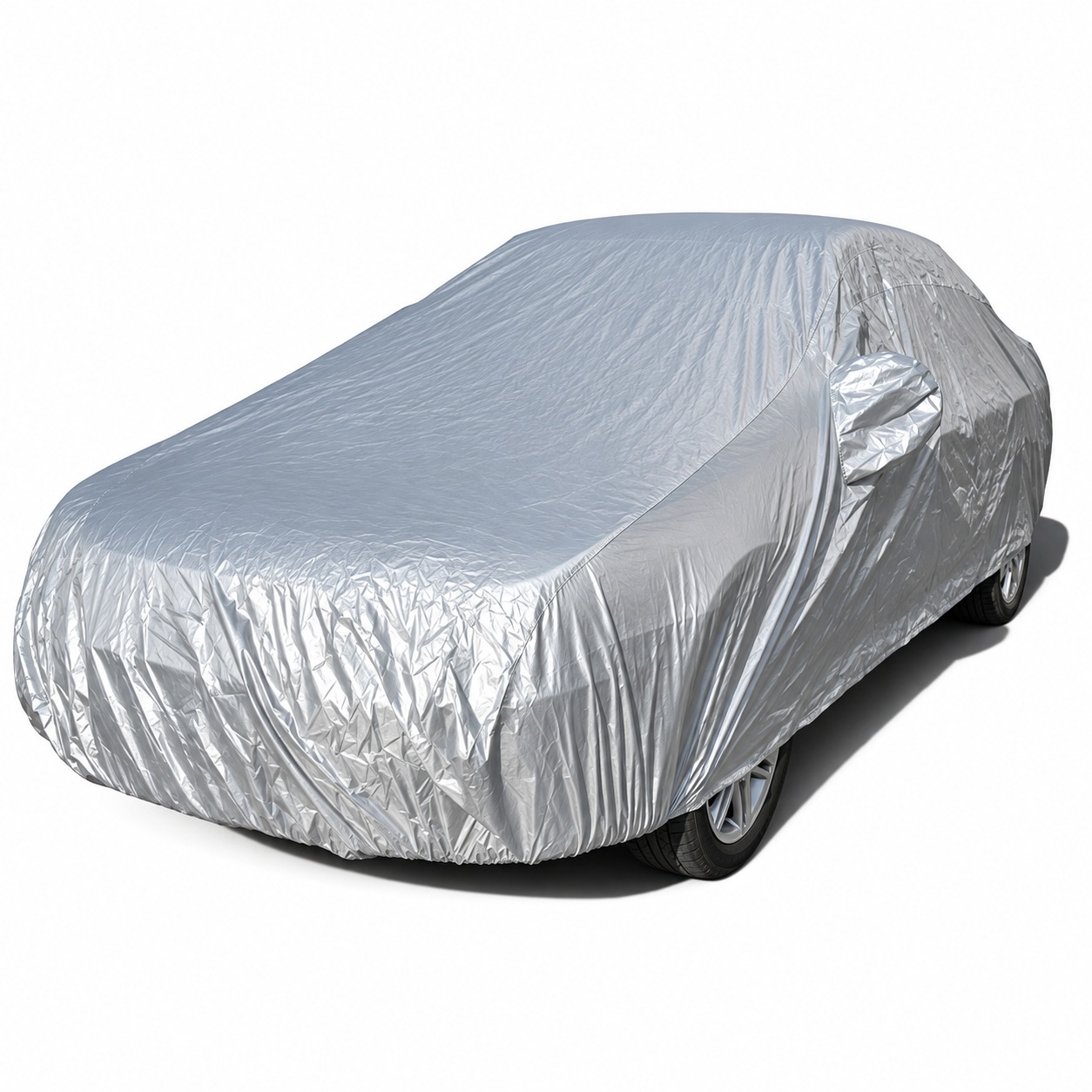 Silver cover draped over a sedan-shaped vehicle.