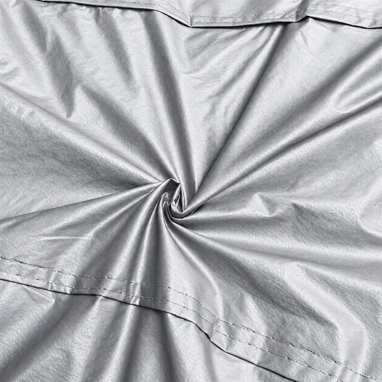 Fabric drape, fine texture and stitched panels.