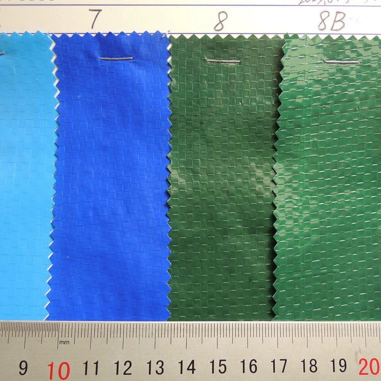 Blue and green coated woven-tape fabric swatches on a sample card.