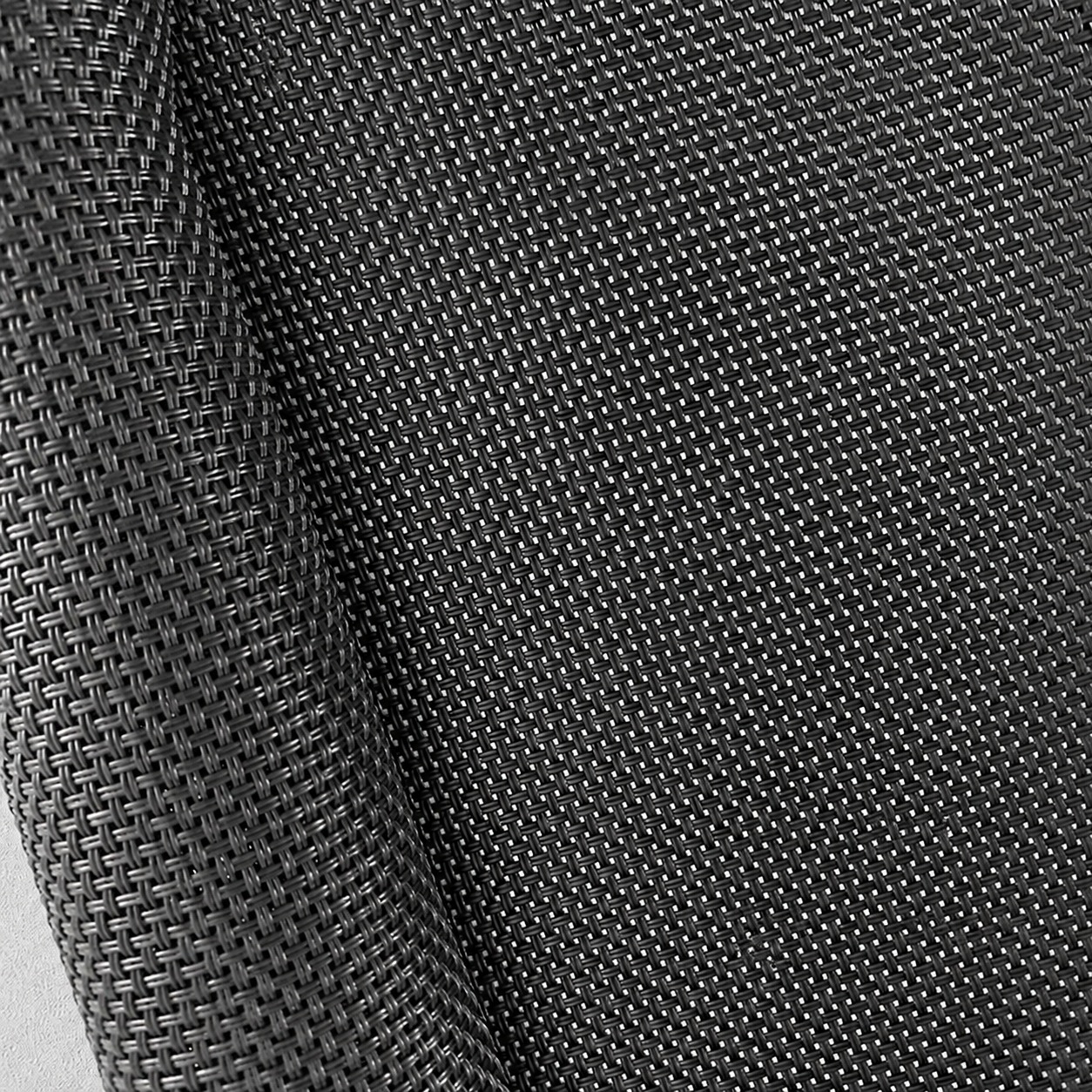 Dark gray mesh with grouped yarns, small rectangular openings and a folded edge.
