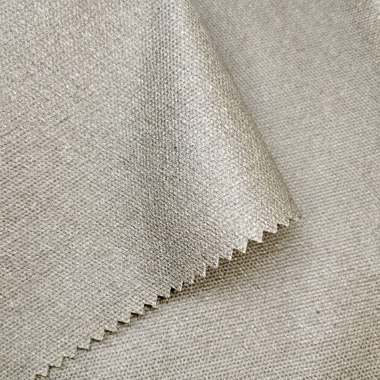 Gray-beige canvas fabric swatches with zigzag-cut edges.