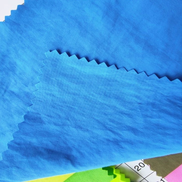 Blue nylon fabric swatches with zigzag cut edges.