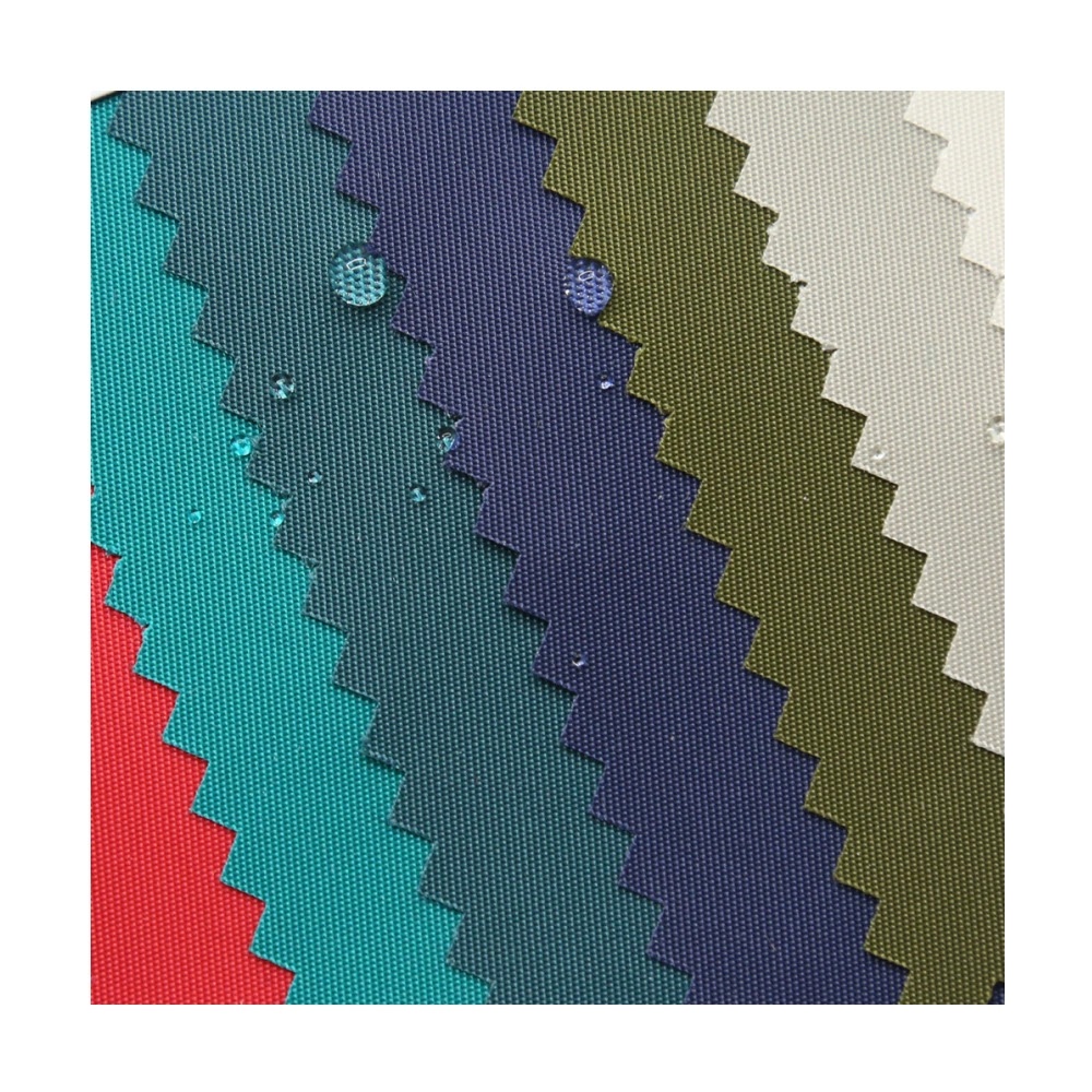 A fan of red, turquoise, teal, navy, olive and ivory fabric samples with zigzag-cut edges.